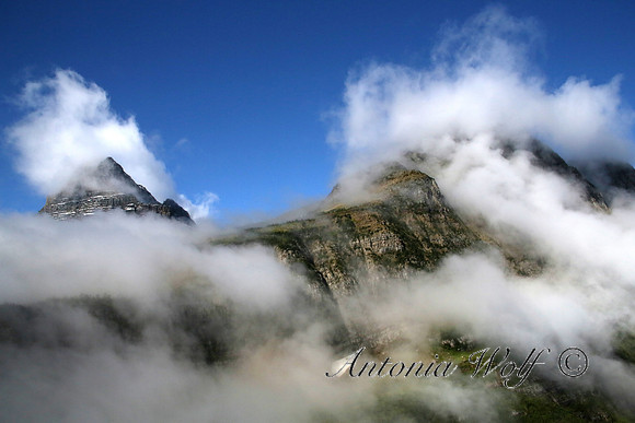 Glacier Summits Embraced by the Clouds