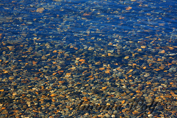 Golden Pepples in Mountain Lake El Chatel Patagonia